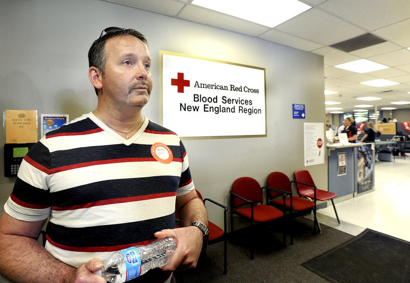 Brian Hodges from West Gardner waits in line at the Red Cross blood donor center in Portland on Friday, July 12, 2013.