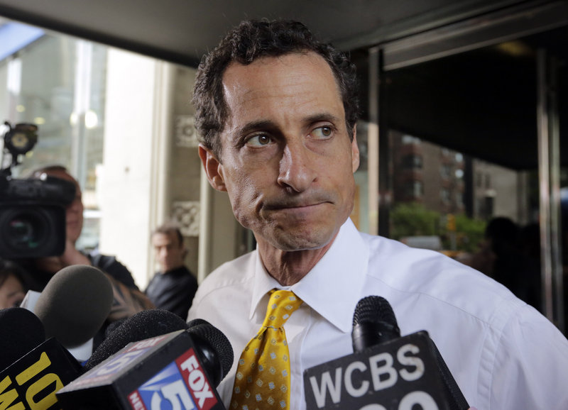 Anthony Weiner leaves his New York apartment building Wednesday. Revelations of sexting destroyed his congressional career two years ago.