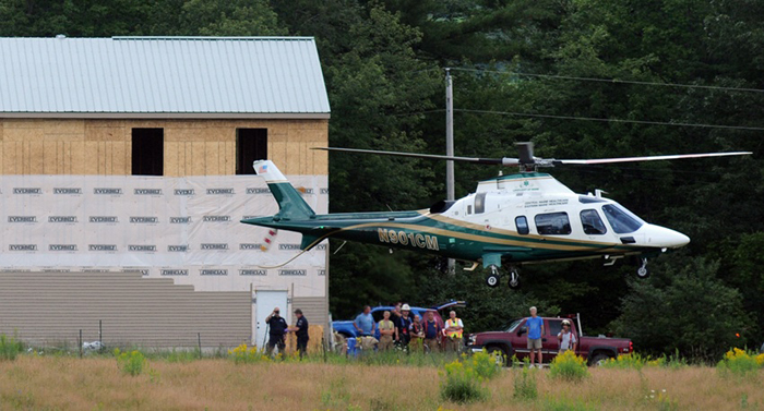 A LifeFlight of Maine helicopter lifts off today with a patient from a building site, between Pleasant Pond Farm Lane and U.S. Route 201 in Richmond, after two carpenters were injured in a fall.