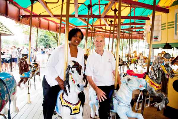 Sharon Langley, with carousel manager Stan Hunter, on the horse she rode 50 years ago. On Aug. 28, 1963, Langley was the first black child to enjoy the newly desegregated Gwynn Oak amusement park outside Baltimore.
