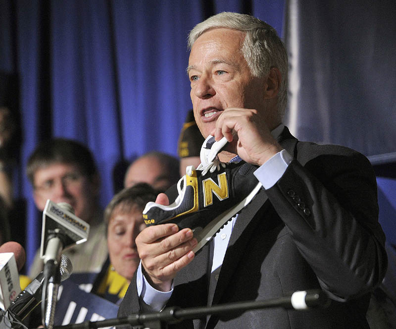 U.S. Representative Mike Michaud announced his candidacy for Governor at a press conference held at the Franco-American Heritage Center in Lewiston on Thursday. Michaud, a proponent of Maine made products, holds a pair of New Balance shoes.