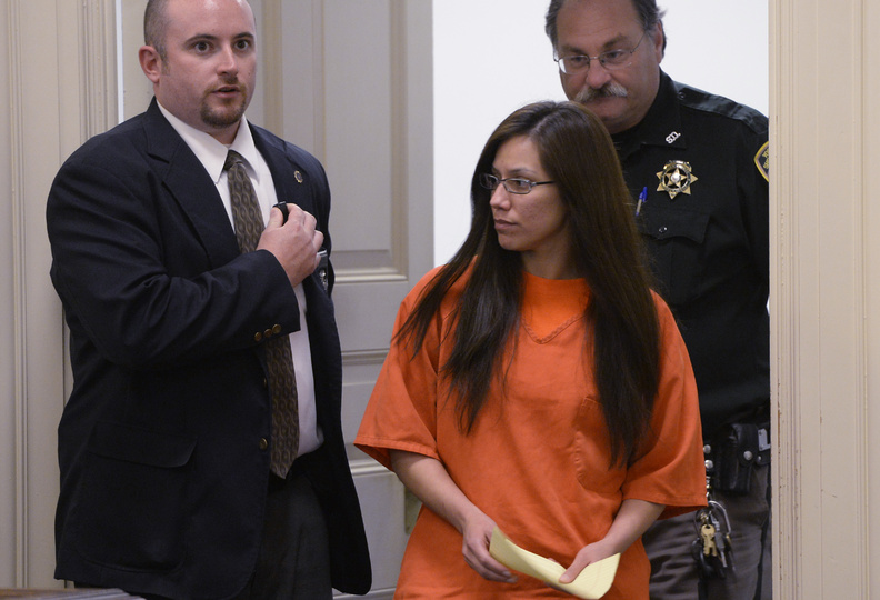 Alexis Wright is escorted into York County Superior Court in Alfred on Thursday.