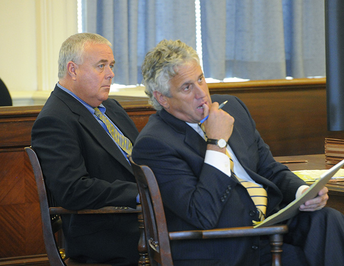 Donald Hill, left, and his attorney Gary Prolman listen to prosecutors' opening arguments at York County Superior Court in Alfred on Monday.