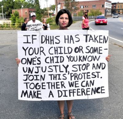 BethMarie Retamozzo, front, and others protest against the Department of Health and Human Services in Skowhegan on Aug. 31, 2012, claiming the agency has illegally taken their children. Retamozzo, then 33 and living in Fairfield, said she began her protest the previous week in Skowhegan and sought to regain custody of her three children. She is accused of abducting her children, Joslyn and Joel Retamozzo, on Thursday, and police said today they believe Retamozzo is traveling with her 2-year-old Hispanic daughter, who is in Retamozzo's legal custody.