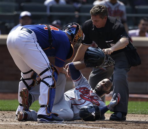 Atlanta Braves' Jason Heyward, center, is helped by New York Mets catcher John Buck, left, and umpire Greg Gibson after being hit by a 90 mph fastball thrown by New York Mets pitcher Jonathon Niese during the sixth inning of a baseball game at Citi Field, Wednesday in New York. Heyward was taken to the hospital for x-rays. (AP Photo/Seth Wenig)
