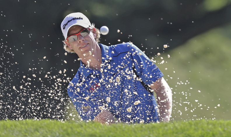 David Hearn of Canada hits out of a bunker on the ninth hole during the first round of the PGA Championship golf tournament at Oak Hill Country Club on Thursday in Pittsford, N.Y.