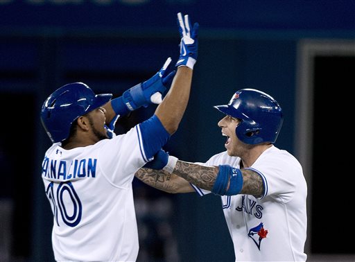 Toronto Blue Jays' Brett Lawrie, right, celebrates with Edwin Encarnacion after Lawrie hit a single to drive in the winning run against the Boston Red Sox during the 10th inning of a baseball game in Toronto on Wednesday, Aug. 14, 2013. Toronto won 4-3. (AP Photo/The Canadian Press, Nathan Denette) Blue Jays;athlete;athletes;athletic;athletics;Canada;Canadian;Center;Centre;competative;compete;competing;competition;competitions;event;game;Jays;League;Major;MLB;pro;professional;Rogers;sport;sporting;sports;Toronto;baseball;American;AL;2013