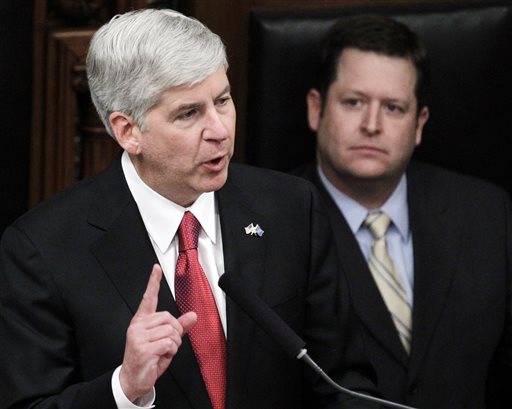 Speaker of the House Jase Bolger, a Republican, listens as Michigan Republican Gov. Rick Snyder delivers an address in Lansing, Mich. Bolger blocked one tough abortion bill this year and Snyder vetoed another last year, which opponents are now trying to circumvent with a ballot initiative.