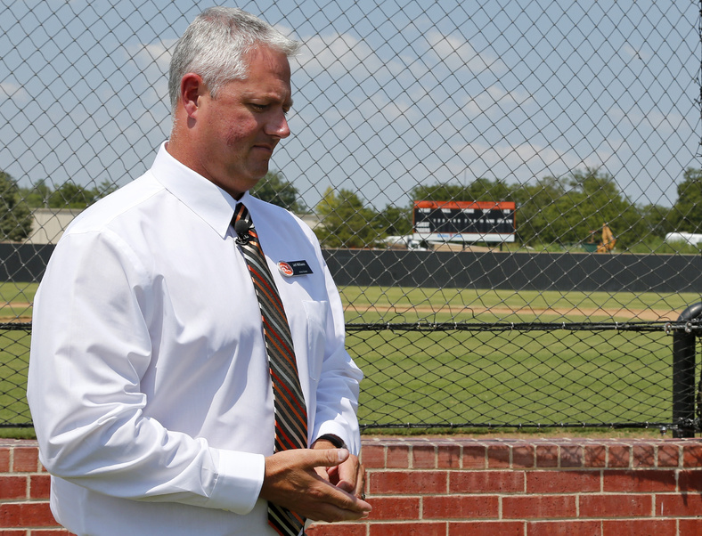 Jeff Williams, director of athletics at East Central University, prepares to talk about Chris Lane during an interview at the baseball field at East Central University in Ada, Okla., on Wednesday. Lane attended the school on a baseball scholarship.