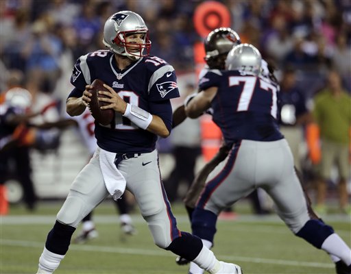 New England Patriots quarterback Tom Brady (12) looks to pass against theTampa Bay Buccaneers in the fist quarter of an NFL preseason football game Friday, Aug. 16, 2013, in Foxborough, Mass. (AP Photo/Charles Krupa)