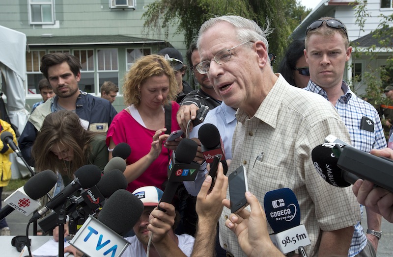 Rail World Inc. President Edward Burkhardt speaks to the media as he tours the devastation in Lac-Megantic, Quebec, on July 10, 2013. Rail World is the parent company of the Montreal, Maine & Atlantic Railway.