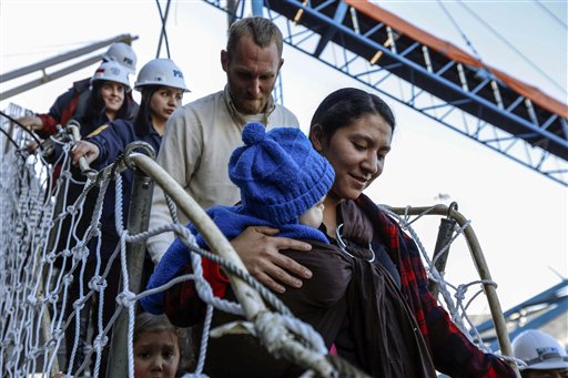Hannah Gastonguay, holding her baby, Rahab, is followed by her husband, Sean, and the couple's 3-year-old daughter, Ardith, as they disembark in the port city of San Antonio, Chile, on Friday. The northern Arizona family was lost at sea for weeks in an ill-fated attempt to leave the U.S. over what they consider government interference in religion. But just weeks into their journey, the Gastonguays hit a series of storms that damaged their small boat, leaving them adrift for weeks. They were eventually picked up by a Venezuelan fishing vessel, transferred to a Japanese cargo ship and taken to Chile where they are resting in a hotel in San Antonio.