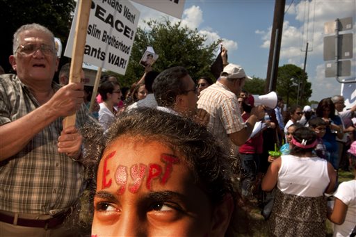 Marvel Merrd, 11, shows her support on her forehead as more than 300 Coptic Christians from Saint Mary & Archangel Michael Coptic Orthodox Church in Houston and other Coptic parishes demonstrate in support of the Egyptian Military in Egypt Sunday, Aug. 18, 2013. They believe Coptic Christians in Egypt are being persecuted by the fundamentalists.