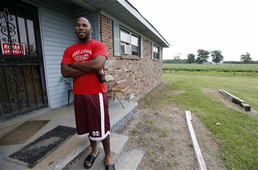 In this July 30 photograph, Perry Turner, 21, who lives across the road from the planned site for GreenTech Automotive's Tunica, Miss., assembly facility, said there was a lot of talk about the new car company years ago in the county of about 11,000 people south of Memphis, Tenn. But that talk has faded and Perry said there has been little activity at the site until recent months.