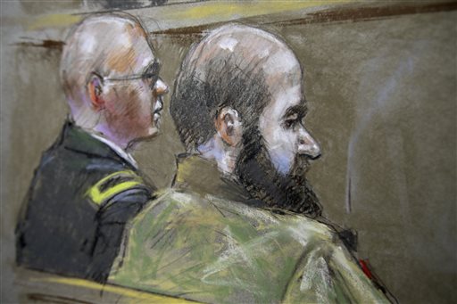 This courtroom sketch shows U.S. Army Maj. Nidal Malik Hasan, right, and his defense attorney, Lt. Col. Kris Poppe, are shown Wednesday in Fort Hood, Texas. Hasan is accused of killing 13 people and wounding more than 30 others at the Texas military base in November 2009.