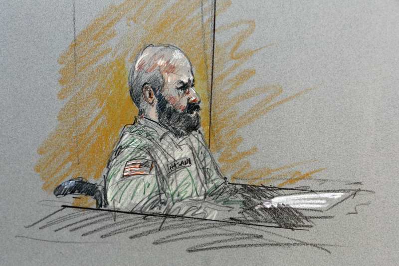 In this courtroom sketch, Maj. Nidal Malik Hasan sits in court for his court-martial Tuesday in Forth Hood, Texas.