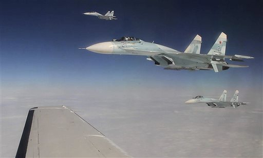 This Tuesday photo taken over the Bering Strait near Alaska shows three Russian Federation Air Force SU-27s intercepting a passenger plane that was hijacked during a simulation to test the response of NORAD and Russian Federation forces.