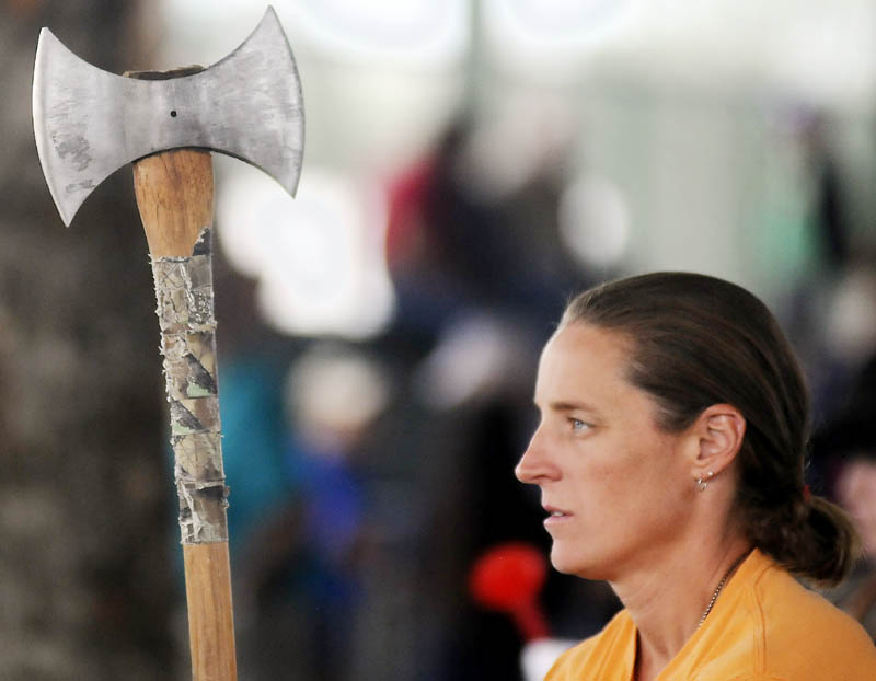 Michelle Morse prepares to launch an ax during a throwing competition today at the Windsor Fair Woodsmen's Field Day.