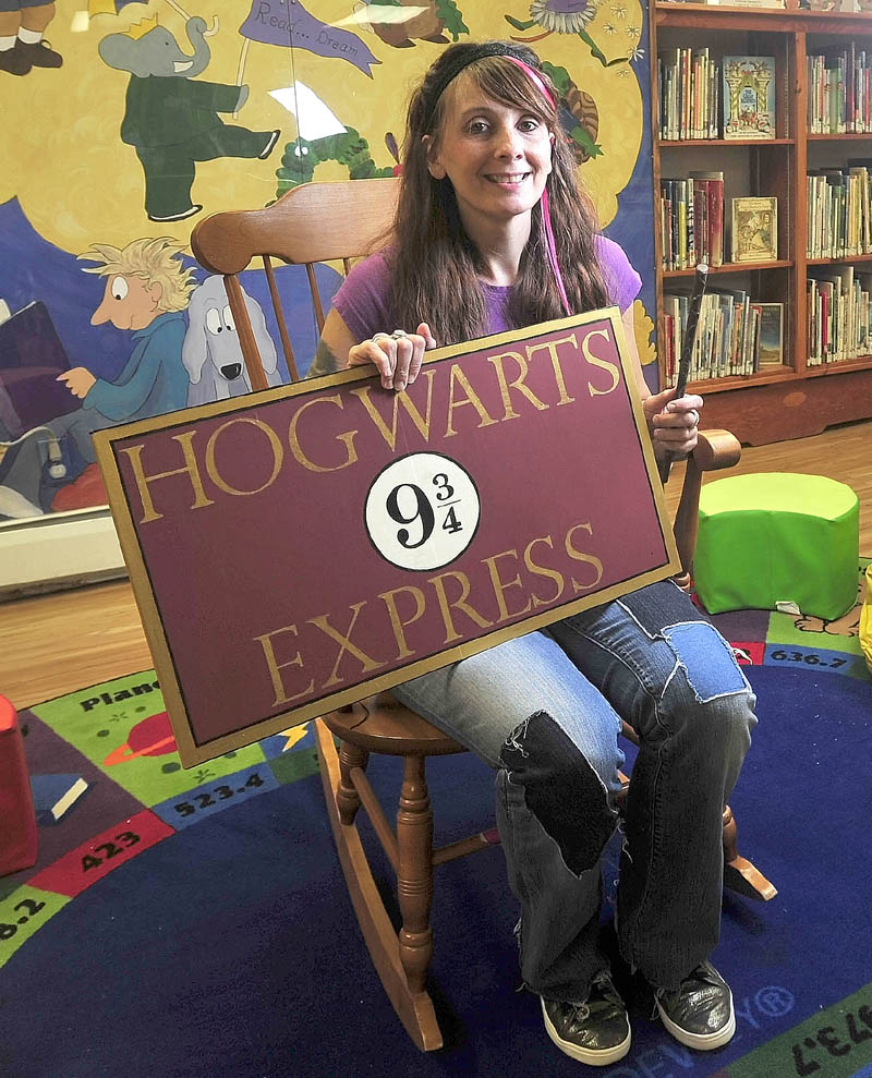 Alyssa Patterson, 33, a librarian at Lawrence Public Library, dresses up as her favorite Harry Potter character, Nymphadora Tonks, on Thursday. Patterson submitted the library's winning application to be one of the 15 locations that will participate in a Harry Potter 15-year anniversary celebration party.
