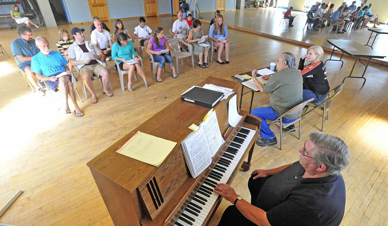 Dave Hovey plays the piano during auditions today for the upcoming production of "Fiddler on the Roof," at the Waterville Opera House dance studio on Main Street in Waterville.