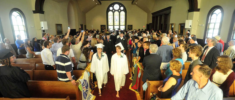 The first graduating class of the Maine Academy of Natural Sciences marches down the aisle at Moody Chapel in Hinckley during the inaugural commencement event today.