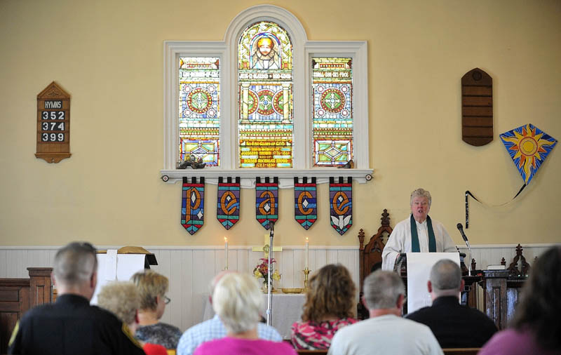 The Rev. Judy Gould speaks at Brown Memorial United Methodist Church during a service honoring police and other first responders in Clinton today.