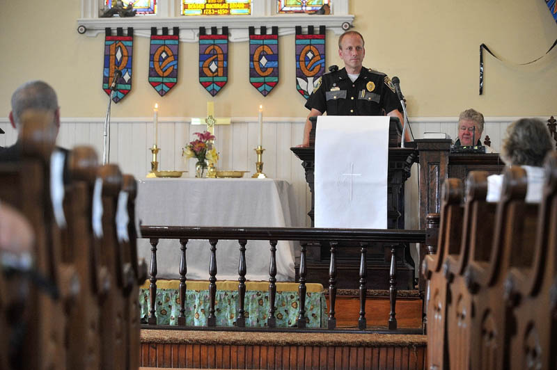 Police Chief Craig Johnson of the Clinton Police Department speaks during a service honoring police and other first responders at Brown Memorial United Methodist Church in Clinton today.
