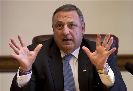 This June 2 file photo shows Gov. Paul LePage speaking to reporters shortly after the Maine House and Senate both voted to override his veto of the state budget at the State House in Augusta. LePage's off-color remarks have offended opponents, galvanized supporters and fueled attacks from the Democratic congressman and independent candidate hoping to unseat him in 2014. But the three-way race shaping up may once again play into LePage's favor.