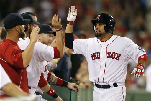 Boston Red Sox outfielder Shane Victorino, right, celebrates his solo home run in the eighth inning off Seattle Mariners pitcher Charlie Furbush on Thursday at Fenway Park in Boston. The Red Sox won 8-7.