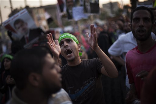 A supporter of Egypt's ousted President Mohammed Morsi chants slogans against the Egyptian army during a protest near Cairo University in Giza, Egypt, on Sunday.