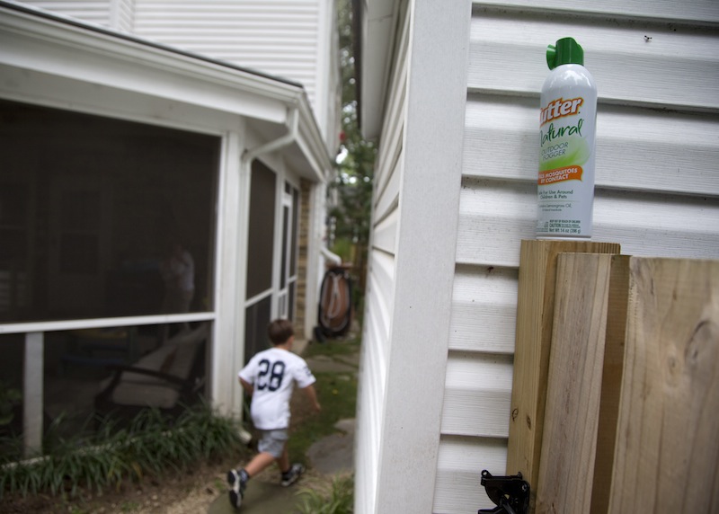 Ryan Miller's son Seaton Miller, 4, runs between homes in Arlington, Va., Monday, Aug. 19, 2013, past a can of bug spray. Miller has been lobbying his local government to break out the pesticides this year to fight mosquitos. Despite our size and technological advantages, we still can't seem to win our ancient blood battle with the pesky and lethal mosquito.. A large section of the United States seems like it is getting eaten alive worse than usual this summer because of quirks in recent weather. It may be the worst in the Southeast, where after two years of drought when mosquito eggs laid dormant, there have been incredibly heavy rains much of the spring and summer. The rains have revived the dormant eggs, so the region is essentially getting three years' worth of mosquitoes in one summer. (AP Photo/Carolyn Kaster)