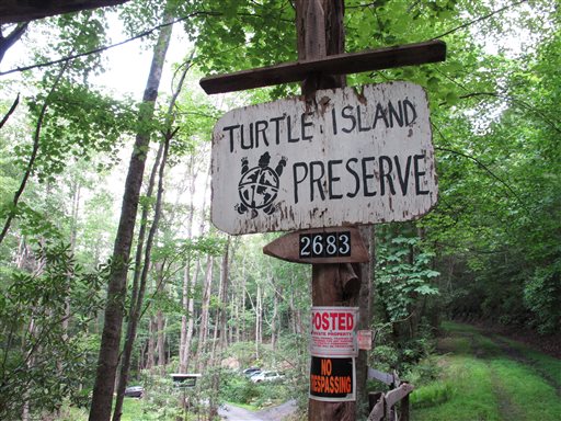 No trespassing signs are posted at the entrance to Turtle Island Preserve in Triplett, N.C., on June 27. Turtle Island lies near the Tennessee border, just a few miles east of Boone, N.C., a county seat of 17,000 residents whose population doubles when Appalachian State University, owner Eustace Conway's alma mater, is in session.