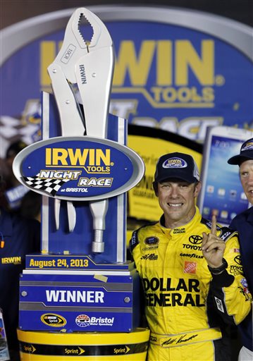 Matt Kenseth stands with the trophy after winning the NASCAR Sprint Cup Series auto race, Saturday, Aug. 24, 2013, at Bristol Motor Speedway in Bristol, Tenn. (AP Photo/Wade Payne) Irwin Tools Night Race;Bristol Motor Speedway