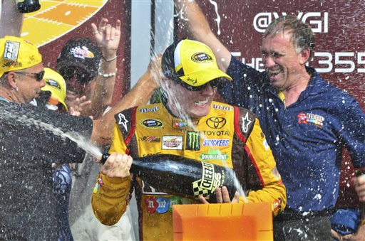 Driver Kyle Busch celebrates in Victory Lane after winning at The Glen on Sunday in Watkins Glen, N.Y.