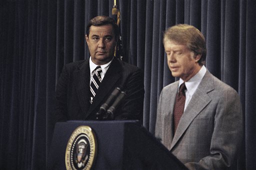 In this Aug. 18, 1977, photo, President Jimmy Carter tells reporters that his confidence in Bert Lance, left, were reconfirmed by a report of federal investigators that found nothing warranting prosecution in his Georgian banking activities.