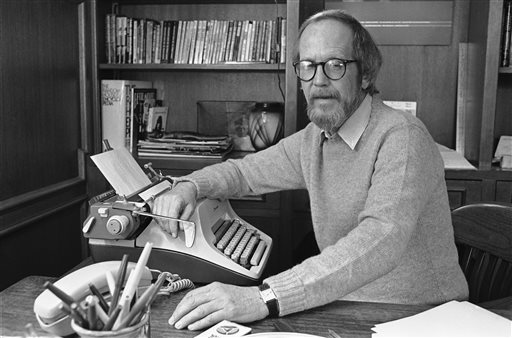 In this March 1983 photo, Elmore Leonard sits by his typewriter at his home in Michigan. Leonard wrote in longhand on unlined yellow pads that were custom-made for him, and when he finished a page he transferred the words onto a separate piece of paper using the typewriter.