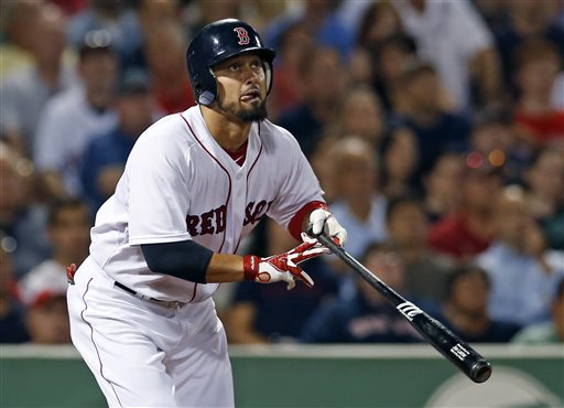 Boston Red Sox's Shane Victorino hits a two-run double against the Baltimore Orioles during the seventh inning of a baseball game at Fenway Park in Boston, Tuesday, Aug. 27, 2013. Victorino homered twice and drove in a career-high seven runs to lead the Red Sox to a 13-2 victory over the Orioles. (AP Photo/Elise Amendola)