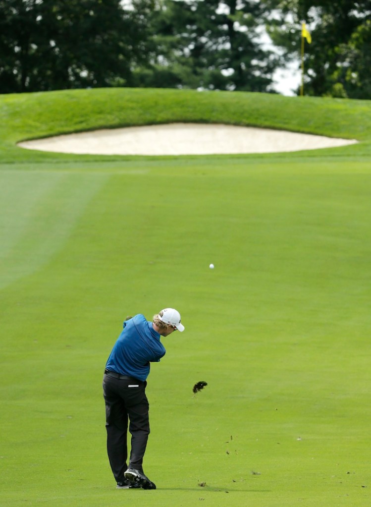 David Hearn, of Canada, hits from the fairway on the 14th hole during the first round of the PGA Championship golf tournament at Oak Hill Country Club, Thursday, Aug. 8, 2013, in Pittsford, N.Y. (AP Photo/Charlie Riedel)