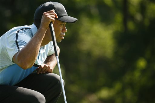 Tiger Woods lines up his putt on the 14th green during the first round of the PGA Championship golf tournament at Oak Hill Country Club, Thursday, Aug. 8, 2013, in Pittsford, N.Y. (AP Photo/The Buffalo News, Derek Gee)