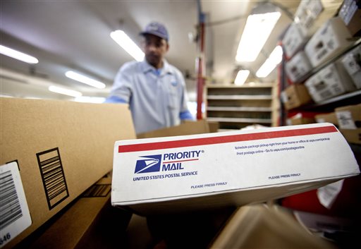 Packages wait to be sorted as U.S. Postal Service letter carrier Michael McDonald gathers mail to load into his truck before making his delivery run in Atlanta.