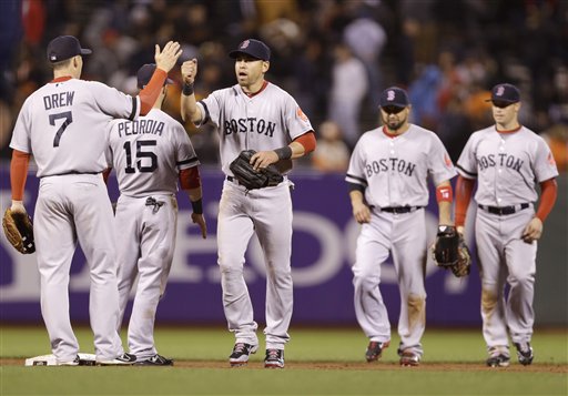 The Boston Red Sox celebrate a 7-0 win over the San Francisco Giants during a baseball game on Monday, Aug. 19, 2013, in San Francisco. (AP Photo/Marcio Jose Sanchez)