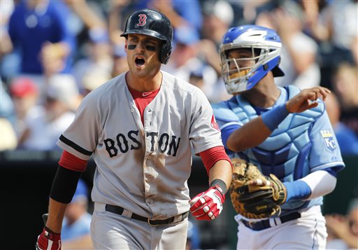 Boston Red Sox third baseman Will Middlebrooks, left, reacts after striking out in the ninth inning Sunday against the Kansas City Royals at Kauffman Stadium in Kansas City. The Royals defeated the Red Sox 4-3.