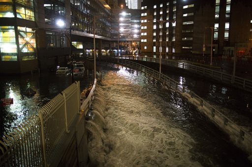 In this Monday, Oct. 29, 2012 file photo, seawater floods the entrance to New York City's Brooklyn Battery in the wake of Superstorm Sandy. A presidential task force recommends 69 measures that might help insure that coastal areas aren't as vulnerable to future storms in an age of rising sea levels.