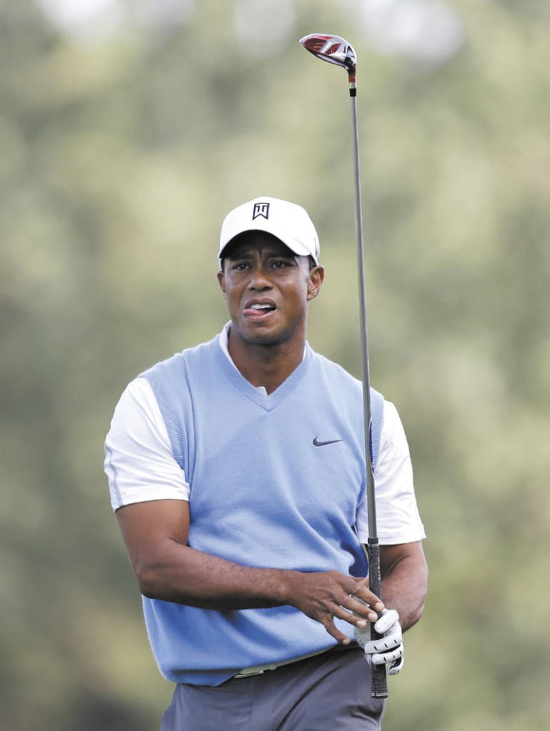 RARING TO GO: Tiger Woods watches his shot from the 16th tee during a practice round Tuesday for the PGA Championship at Oak Hill Country Club, in Pittsford, N.Y.