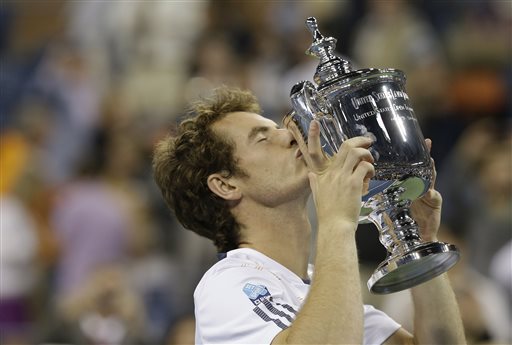 Britain's Andy Murray poses with the trophy after beating Serbia's Novak Djokovic in the championship match at the 2012 US Open tennis tournament in New York. Britain's first male champion at Wimbledon in 77 years will attempt to defend a Grand Slam title for the first time in his career, at the U.S. Open. 2012 US Open Tennis