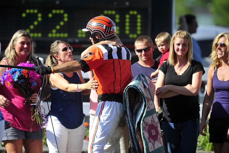GOOD JOB: W. Drue Campbell, driver of the winning horse Real Special is congratulates in the winner’s circle after the Walter H. Hight Memorial Pace on Saturday at the Skowhegan Fairgrounds.