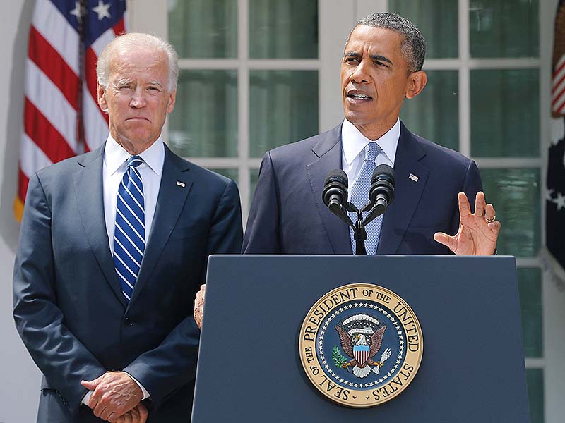 President Barack Obama stands with Vice President Joe Biden as he makes a statement about Syria in the Rose Garden at the White House in Washington on Saturday. Obama said he has decided that the United States should take military action against Syria in response to a deadly chemical weapons attack, and he will seek congressional authorization for the use of force.