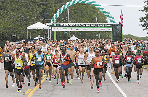 HERE WE GO: Runners, including eventual winner Micah Kogo (bib 3 in blue shirt, black shorts) of Kenya, leave the start line of the 16th annual TD Bank Beach To Beacon 10K road race Saturday in Cape Elizabeth.