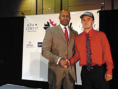 WELCOME ABOARD: Maranacook graduate Ryan Martin, right, was drafted by the Island Storm of the National Basketball League of Canada on Monday night. The Island Storm play on Prince Edward Island.