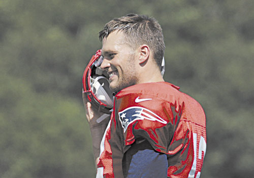 BACK FOR MORE: Despite turning 36 today, New England Patriots quarterback Tom Brady kept pace with his backups — both more than a decade younger — during training camp Friday.